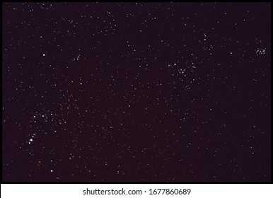sky in the night with stars planets and comets. orion's belt constellation, taurus and pleiades