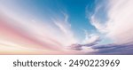 sky panorama featuring soft pink to blue gradient hues, delicate crescent moon presence, peaceful dawn or dusk setting, ethereal cloud formations stretching across horizon