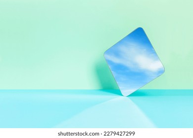 sky reflected from mirror on colored background