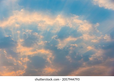 Sky, small clouds and sun rays, dawn, morning light, full frame - Shutterstock ID 2057944793