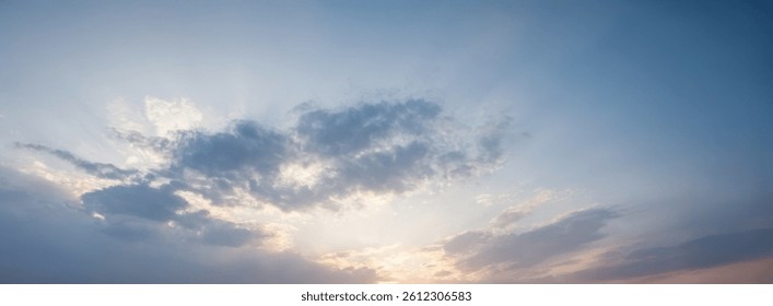 Sky with soft clouds and light at sunset or sunrise.