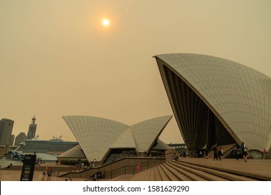 The Sky And The Sun Over The Opera House Were Covered By Heavy Red Smoke From Bushfire, Australia 7-12-2019