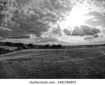 
sky. the sun is shining. the clouds. shining through the clouds. black and white photography.