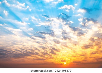 Sky, sunrise, sunset, luxury soft gradient orange gold clouds and gold sunlight between group of blue clound sky perfect for the background, take in everning,Twilight, high definition landscape photo