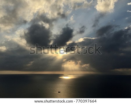 Sky sunset clouds with dark ocean