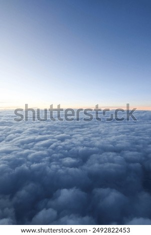 sky with thick cloud and blue sky with slight light from the left taken on the plane suitable for wallpaper