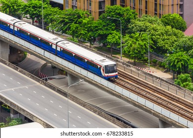 The Sky train in Bangkok with building