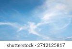 The sky is a vibrant, cloudless blue, while the sun shines brightly, making it appear even more radiant.