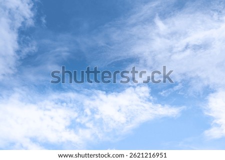 The sky is a vibrant, cloudless blue, while the sun shines brightly, making it appear even more radiant.