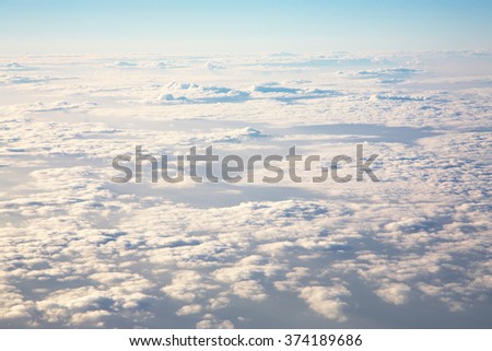 sky view from an airplane above the clouds