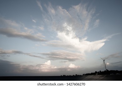 Sky With Wind Turbine For Electricity Generating In The Bright Evening, Abstract Cloud Over Blue Blackgrond, Taken By Wide Angle Lens