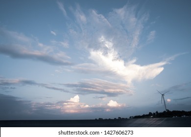 Sky With Wind Turbine For Electricity Generating In The Bright Evening, Abstract Cloud Over Blue Blackgrond, Taken By Wide Angle Lens