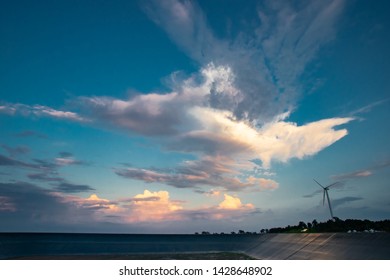 Sky With Wind Turbine For Electricity Generating In The Bright Evening, Abstract Cloud Over Blue Blackgrond, Taken By Wide Angle Lens