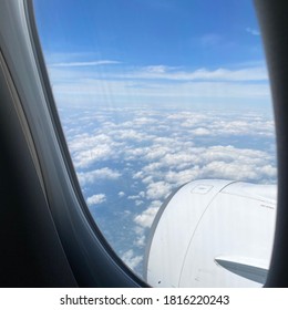 Sky And Wings Seen From Inside An Airplane