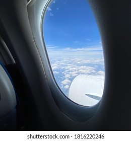 Sky And Wings Seen From Inside An Airplane