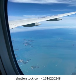 Sky And Wings Seen From Inside An Airplane