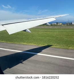 Sky And Wings Seen From Inside An Airplane