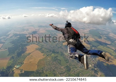 Skydiver fly over the clouds with copy space	