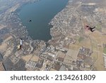 Skydivers are having fun in the sky.