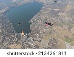 Skydivers are having fun in the sky.
