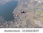 Skydivers are having fun in the sky.