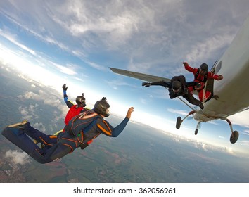 Skydiving Friends Jumping From The Plane