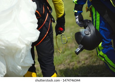 Skydiving Gear In The Hands Of Skydivers, Close-up, Face Is Not Visible.