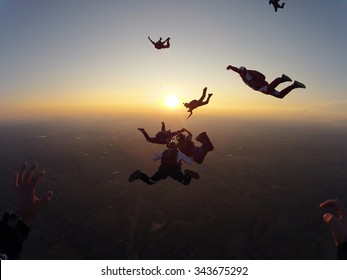 Skydiving At The Sunset Meeting Of Friends