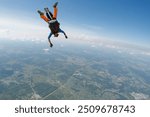 Skydiving tandem in a free fall with copy space