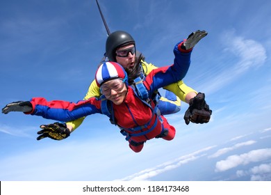 Skydiving. Tandem Jump. Asian Woman And Instructor.