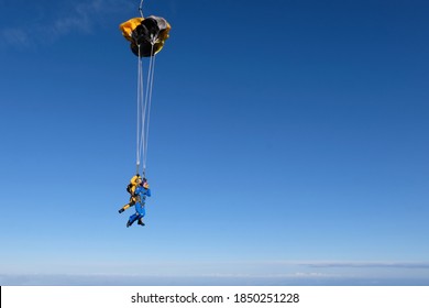 Skydiving. Tandem jump. A parachute deployment.