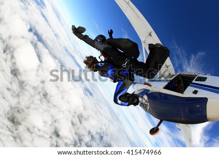 Skydiving tandem jumping from the plane