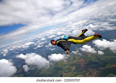Skydiving Wing Suit Over Clouds