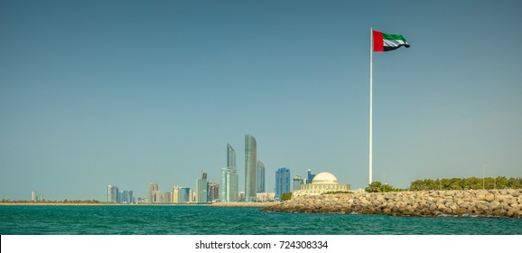 Skyline Of Abu Dhabi, With The Flag Of The UAE