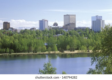Skyline of Anchorage with Lake Spenard in the foreground and Mt. Hood in the background
