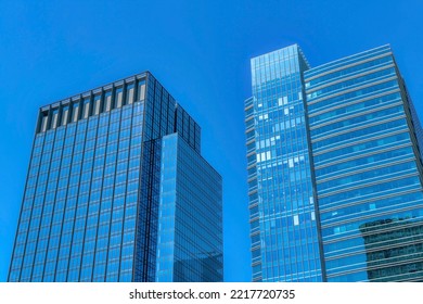 Skyline Of Austin Texas With Glass Buildings And Apartments Against Blue Sky. Facade Of Flats And Condominiums With Glass Windows Reflecting The City Structures On A Sunny Day.