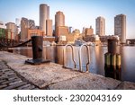 The skyline of Boston in Massachusetts, USA at sunrise at the Fan Pier showcasing its mix of contemporary and historic architecture.