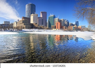 Skyline of Calgary, Alberta, Canada. Bow River partly covered with Snow and Ice. Picture taken March 8, 2013