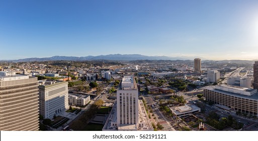 Skyline Of Downtown Los Angeles Skyscrapers With Blue Sky And Mountains