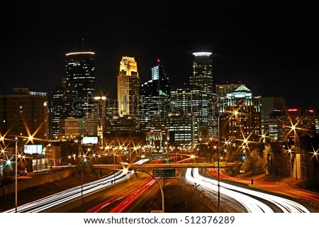 Skyline of downtown Minneapolis, Minnesota taken from the 35W Bridge overpass at night in Long Exposure HDR.