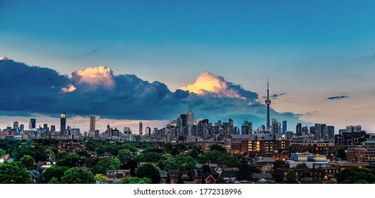 Skyline of Downtown Toronto at dusk from a rooftop in Little Portugal
