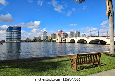 The Skyline Of Downtown West Palm Beach, Florida And The Waterfront Walking Park Along The Lake Worth Lagoon.