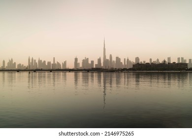 Skyline of Dubai reflecting in the water - Shutterstock ID 2146975265