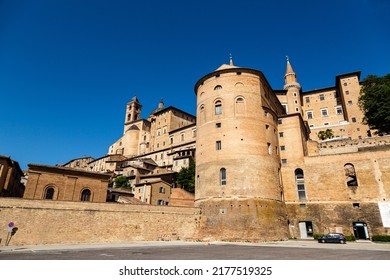  Skyline With Ducal Palace In Urbino, Italy. The Historic Center Of Urbino Was Declared A Unesco World Heritage Site And Represents The Zenith Of Renaissance Art And Architecture.