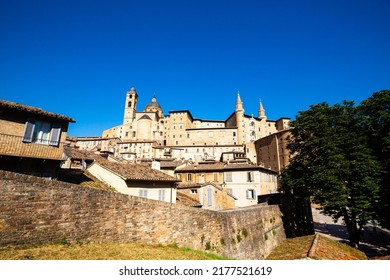 Skyline With Ducal Palace In Urbino, Italy. The Historic Center Of Urbino Was Declared A Unesco World Heritage Site And Represents The Zenith Of Renaissance Art And Architecture.