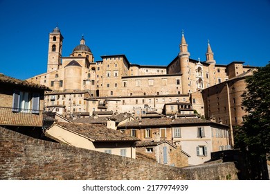 Skyline With Ducal Palace In Urbino, Italy. The Historic Center Of Urbino Was Declared A Unesco World Heritage Site And Represents The Zenith Of Renaissance Art And Architecture.