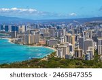 Skyline of Honolulu city as seen from Diamond Head State Monument lookout, with Waikiki beach landscape and ocean views.