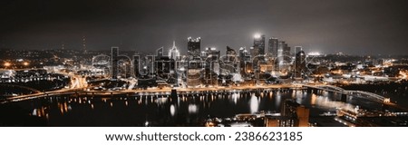 A skyline of the illuminated Pittsburgh at night