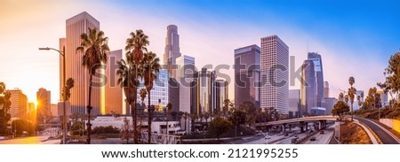 the skyline of los angeles during sunrise