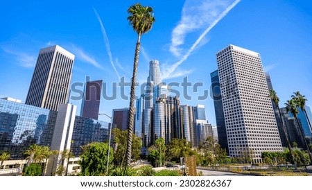the skyline of los angeles under a blue sky